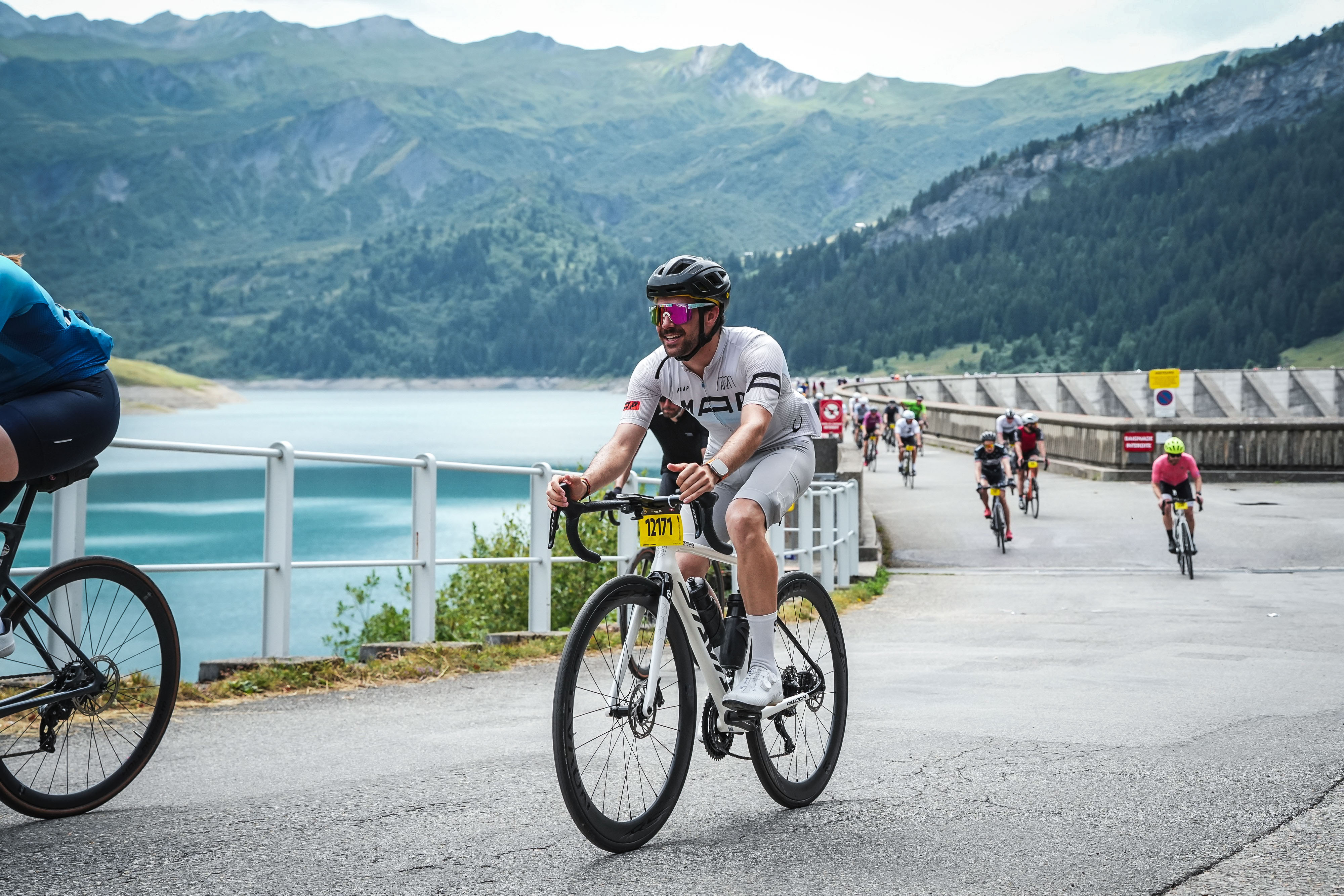 Cyclists riding SAVA carbon bikes on a scenic route